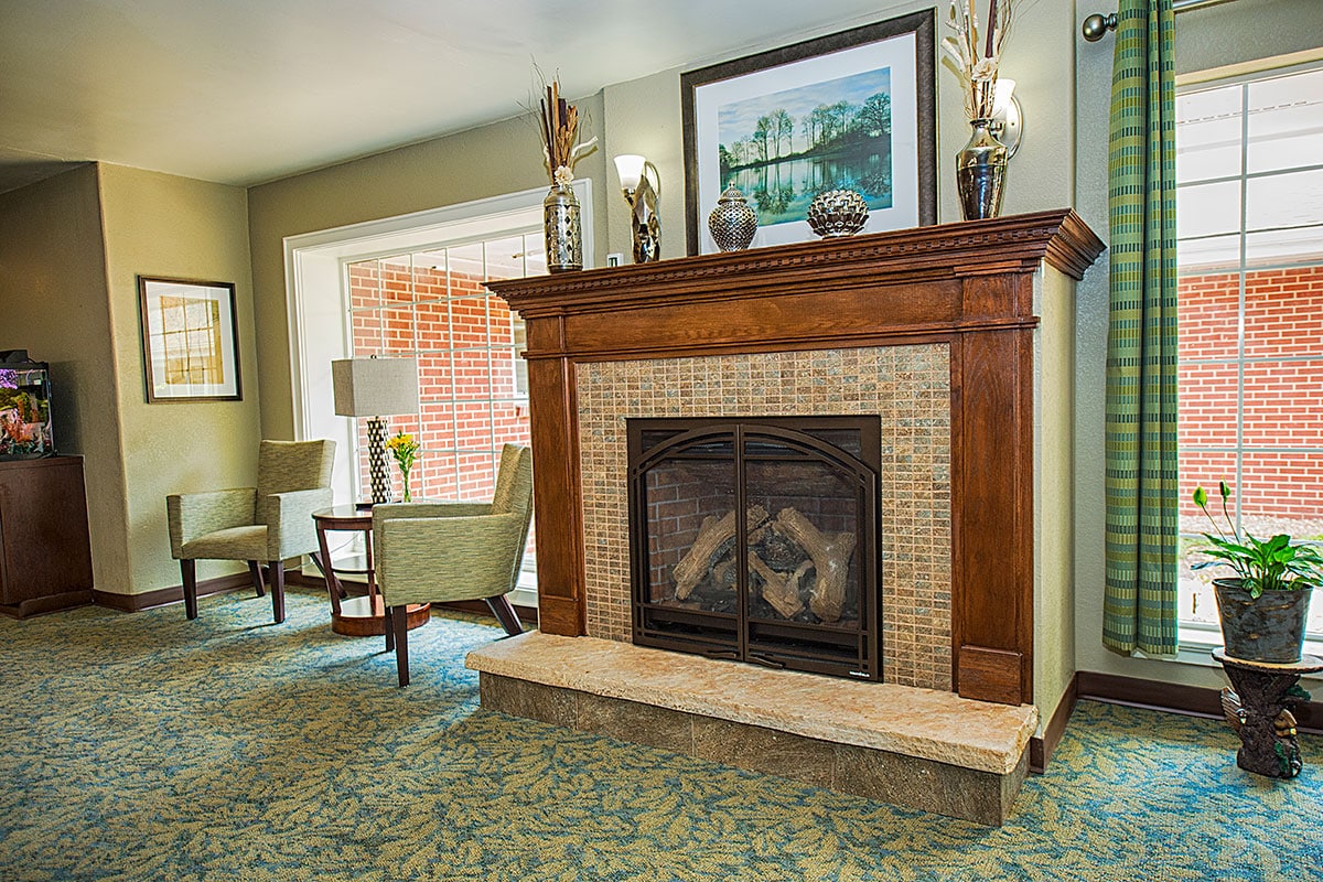 fireplace in the lobby and soft seating at the Lakeside Post Acute facility