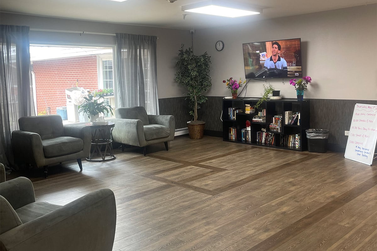 Seating area at Lakeside Post Acute with large picture window and TV